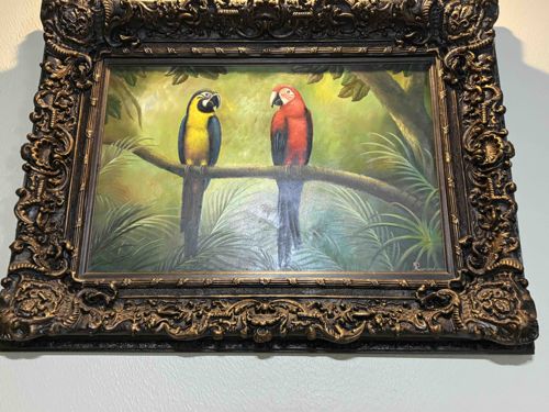 Painting of Two Macaws on a Branch in an Ornate Frame