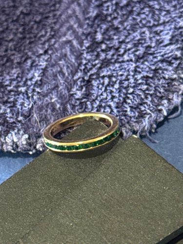 Gold-Toned Eternity Ring with Emerald Green Stones