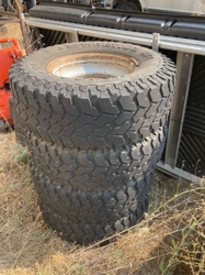 Stack of Four BFGoodrich All-Terrain T/A Tires on Steel Wheels