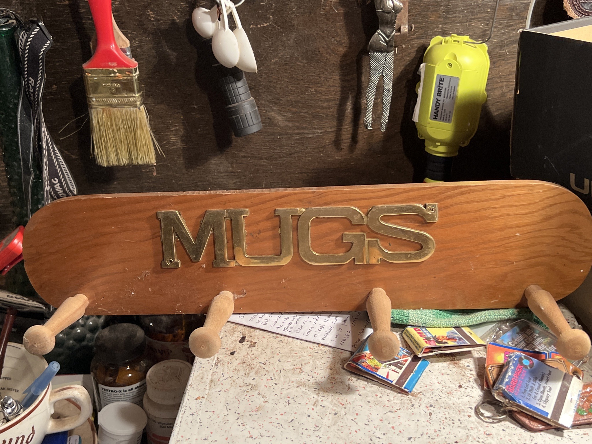 Submitted photo of Wooden mug rack with brass letters