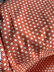 Geometric Coral and Cream Patterned Fabric