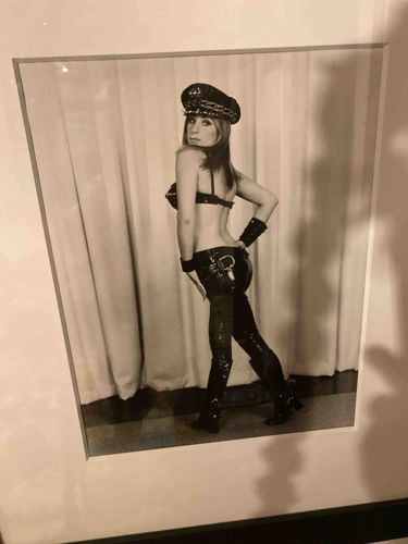 Black and White Photograph of a Woman in Provocative Attire