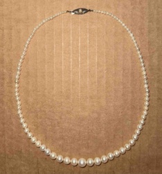 Graduated Pearl Necklace with Embellished Clasp