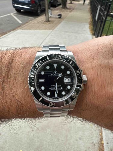 Rolex Submariner Date (Likely Reference 116610LN or 126610LN)