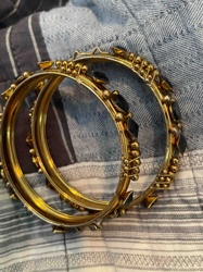 Pair of Gilt Metal or Brass Bangles with Black Stone Inlays