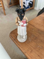 Anthropomorphic Dog Figure Holding a Book