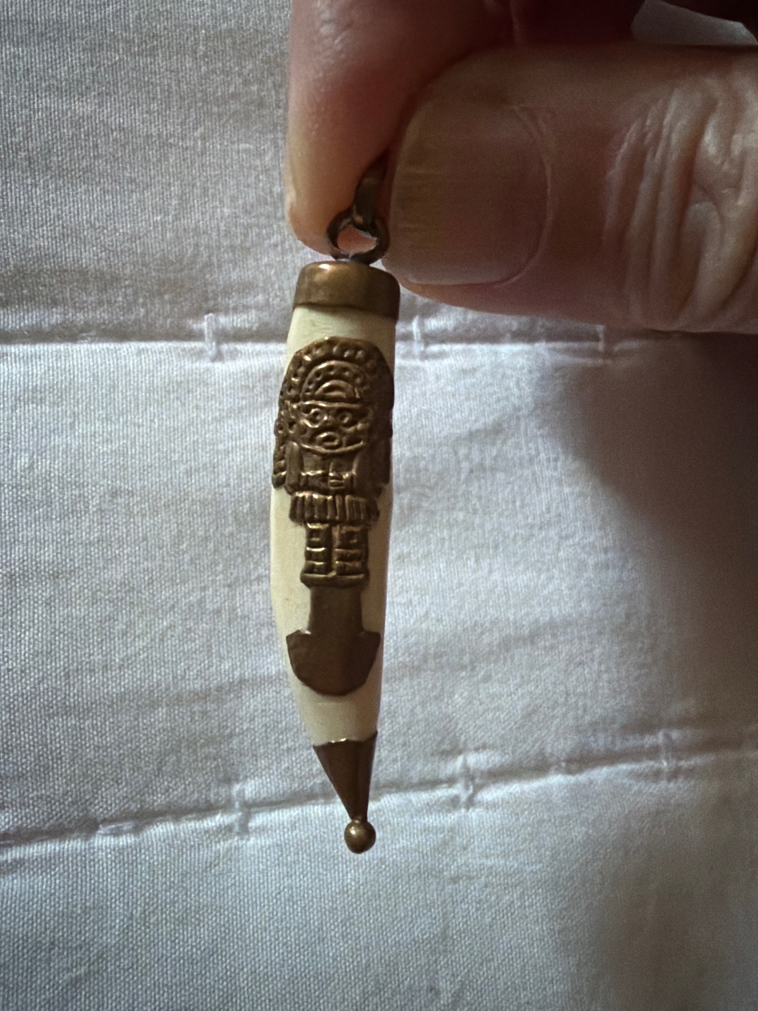 Submitted photo of Pre-Columbian style pendant with bone or ivory-like tusk and metal overlay