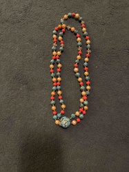 Multi-strand Beaded Necklace with Central Mottled Blue Bead