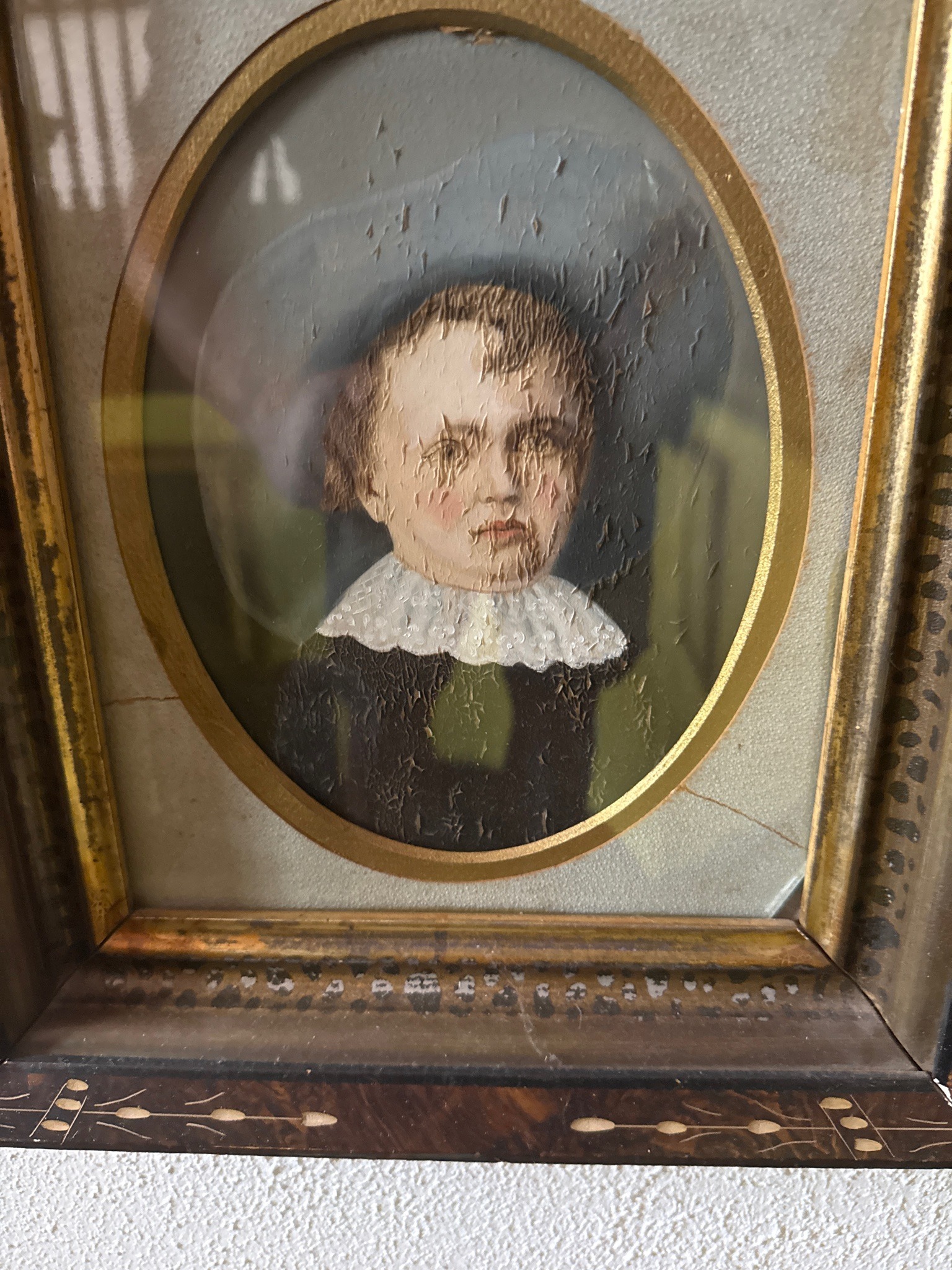 Submitted photo of Framed portrait painting of a young child
