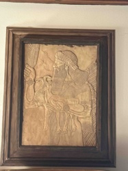 Assyrian-Style Bas-Relief Wall Art Depicting a Winged Deity with a Goat