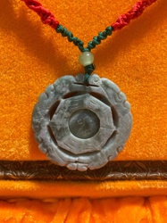 Carved Jade Pendant with Braided Cord