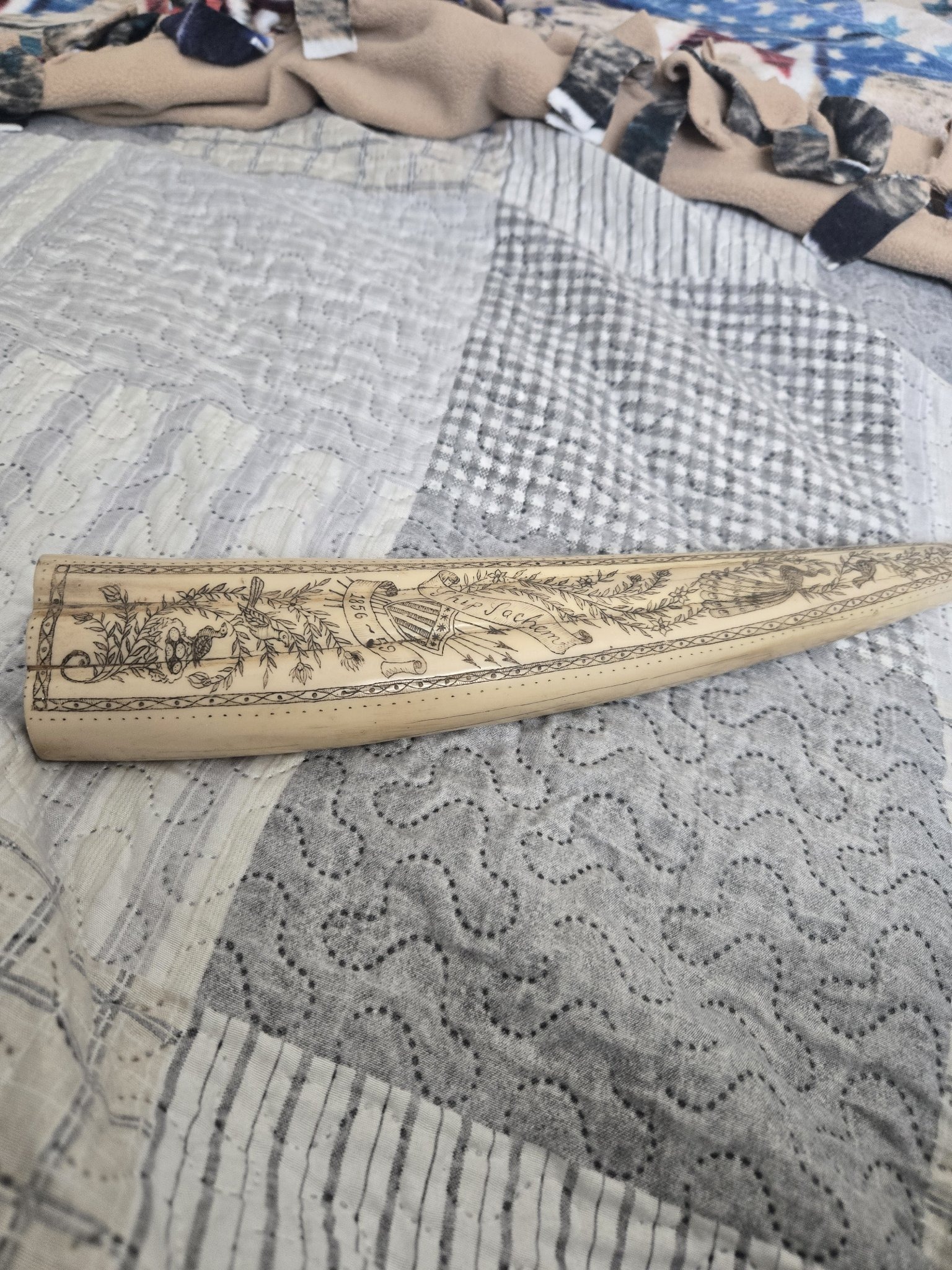 Submitted photo of Scrimshaw whale tooth (unauthenticated)