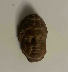Fragmentary Head of a Deity (Likely Buddha or Bodhisattva)