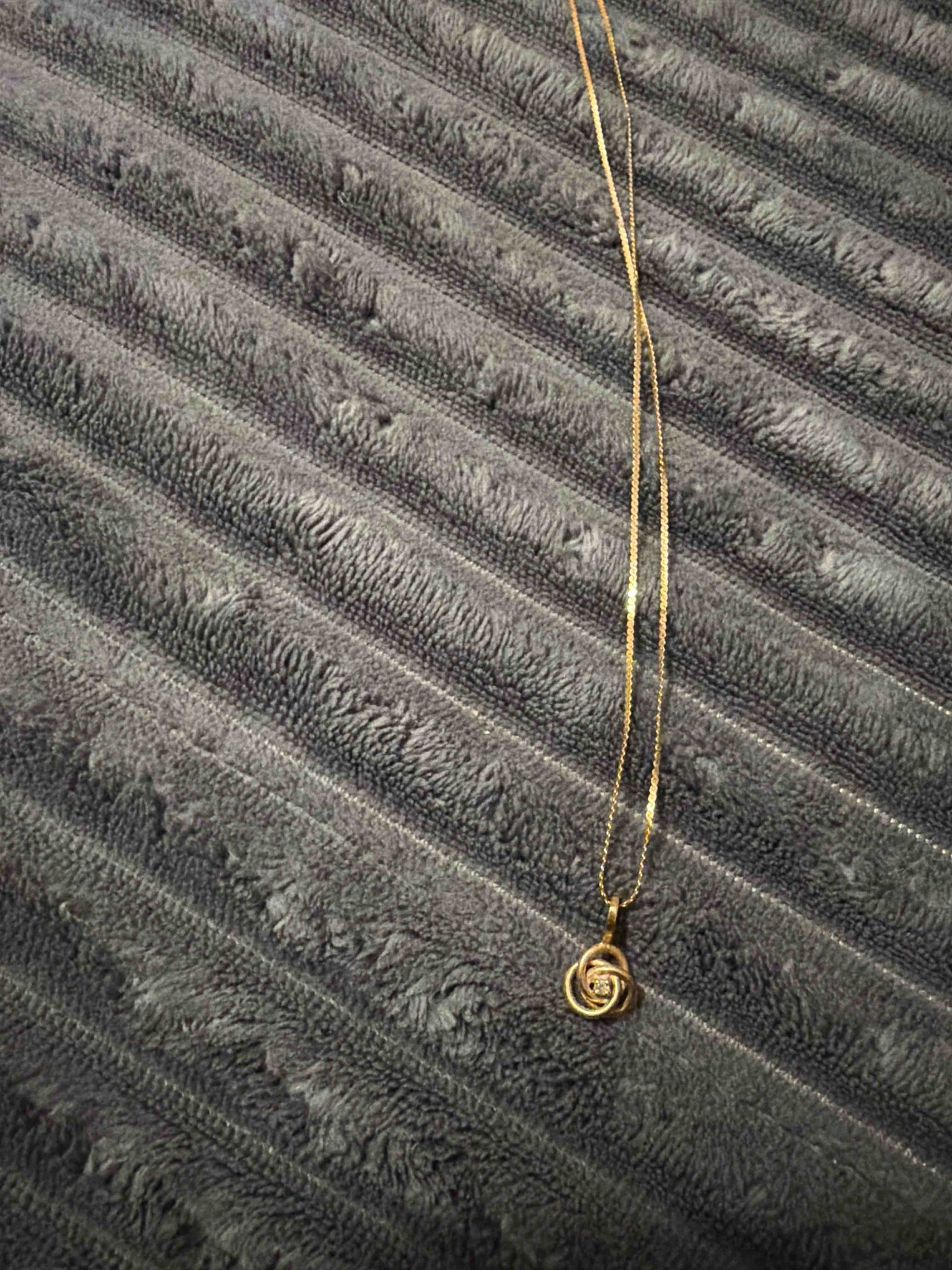 Gold Knot Pendant Necklace with Central Gemstone