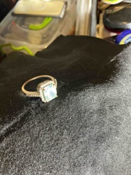 Halo Engagement Ring with Emerald Cut Center Stone