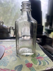 Vintage Clear Glass Bottle with Embossed Markings