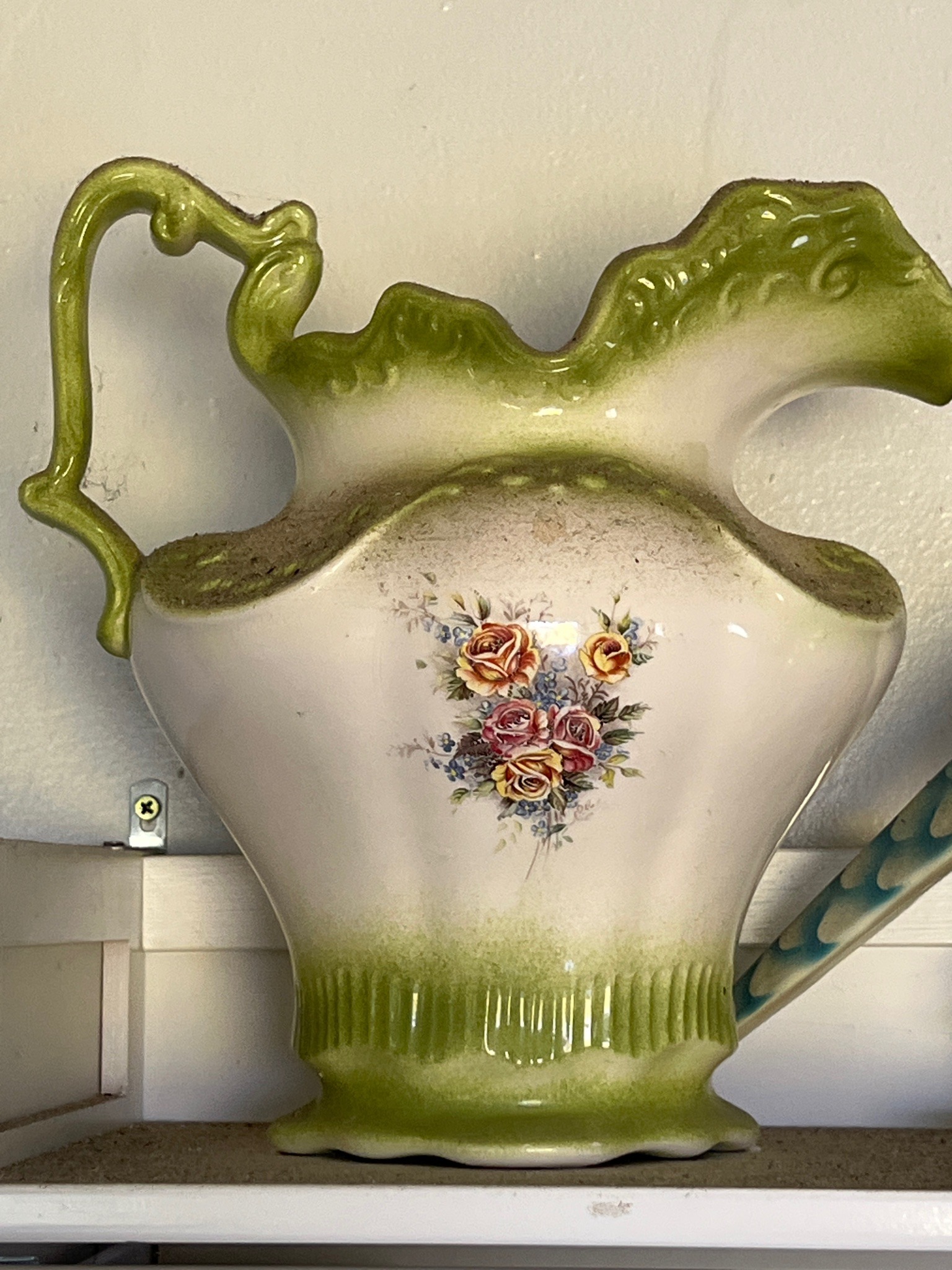 Submitted photo of Hand-painted ceramic pitcher with rose motif