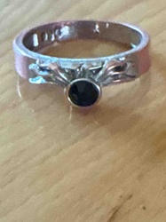 Silver-Toned Ring with Dark Gemstone and Filigree Accents