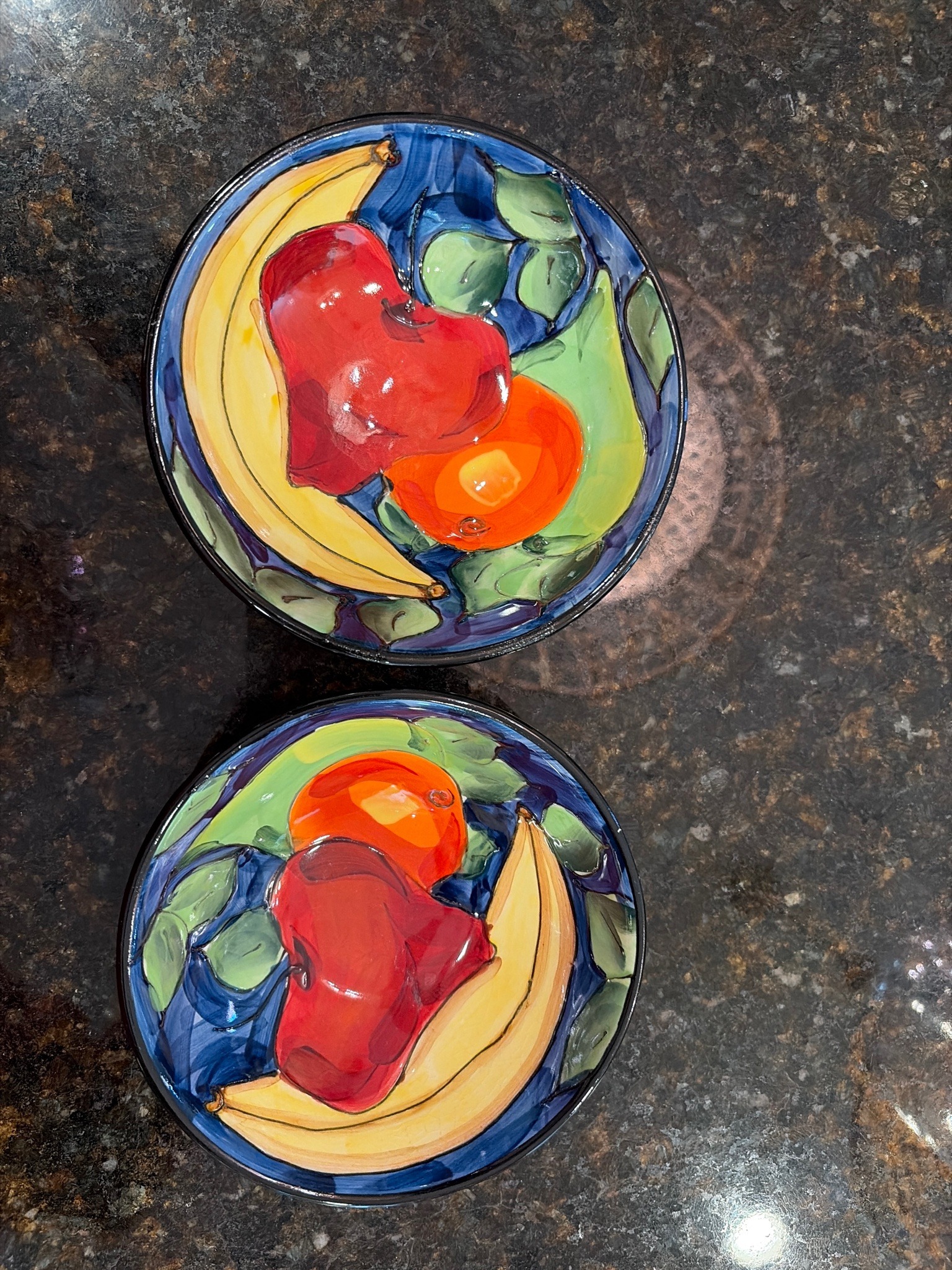 Submitted photo of Hand-painted ceramic bowls depicting fruit