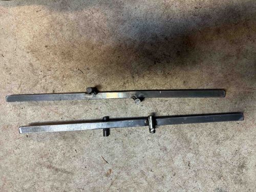 Adjustable Metal Bars (Likely Alignment Tools)