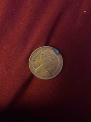 1985 British or Commonwealth Coin featuring Queen Elizabeth II (drilled)