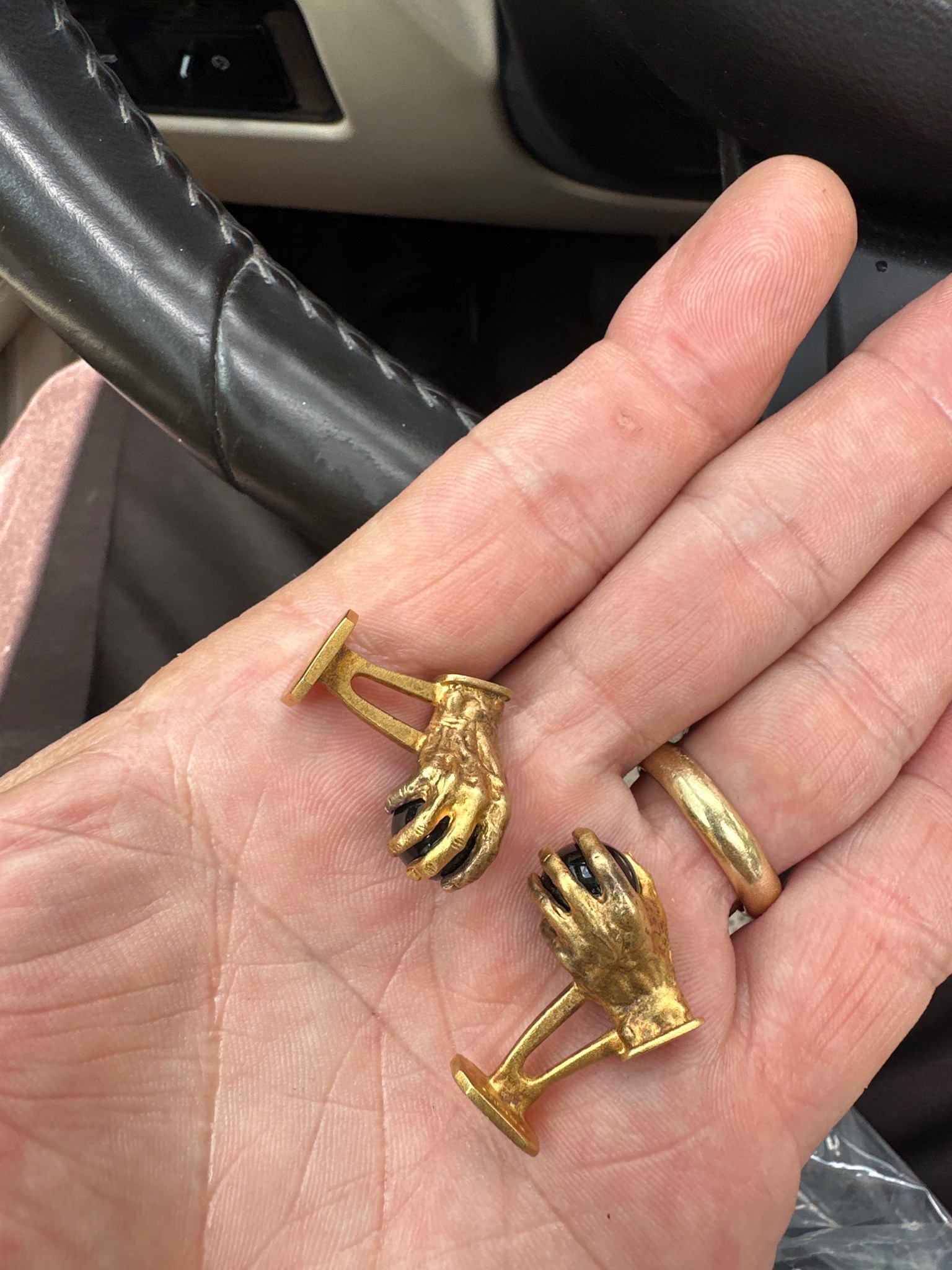 Submitted photo of Gold-toned figural hands cufflinks (unauthenticated)