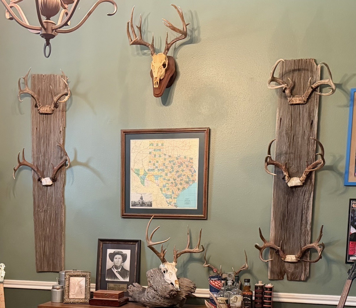 Submitted photo of Taxidermy antler mounts and framed map display