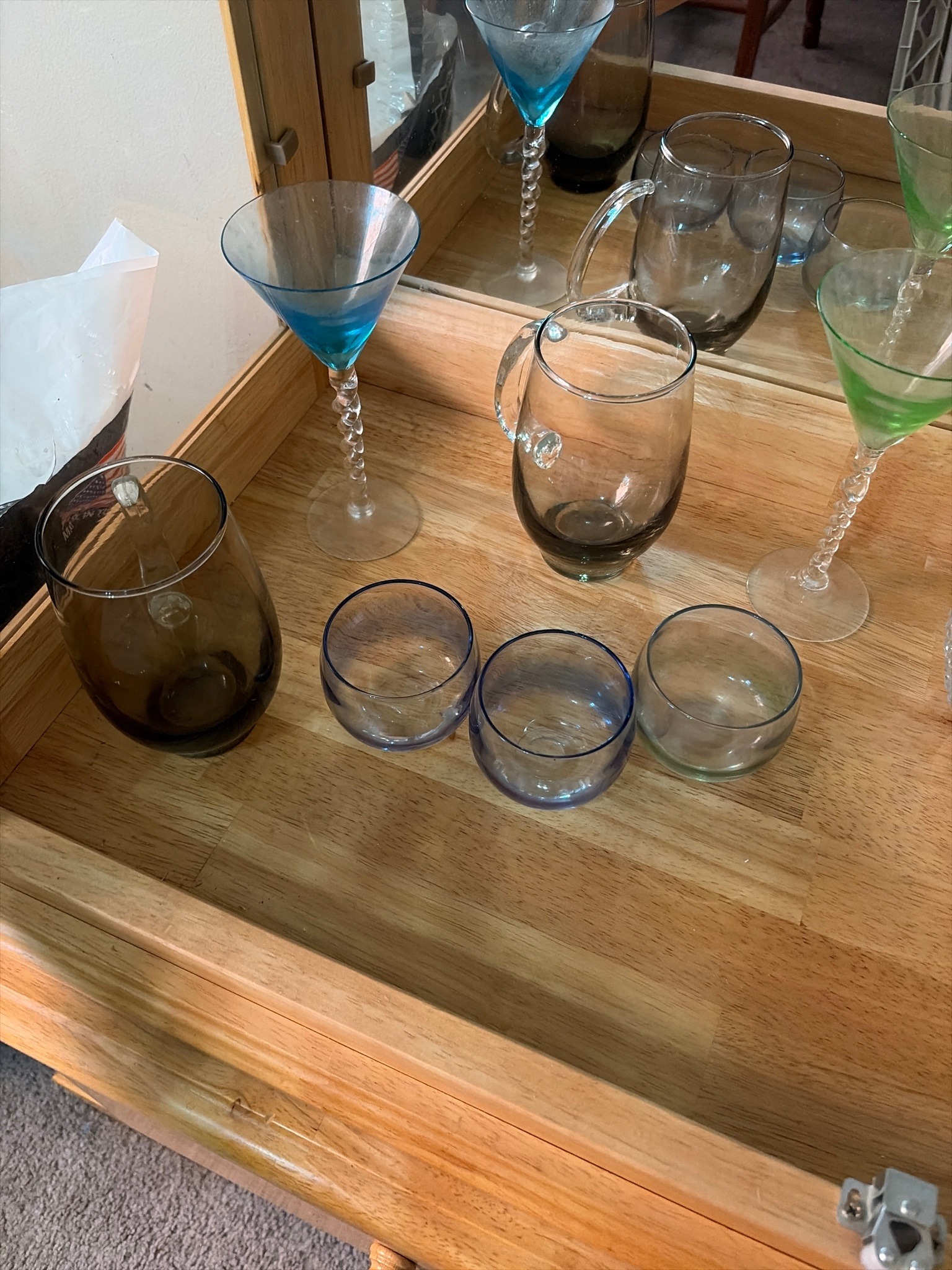 Submitted photo of Assorted glassware collection including stemmed cocktail glasses and mugs