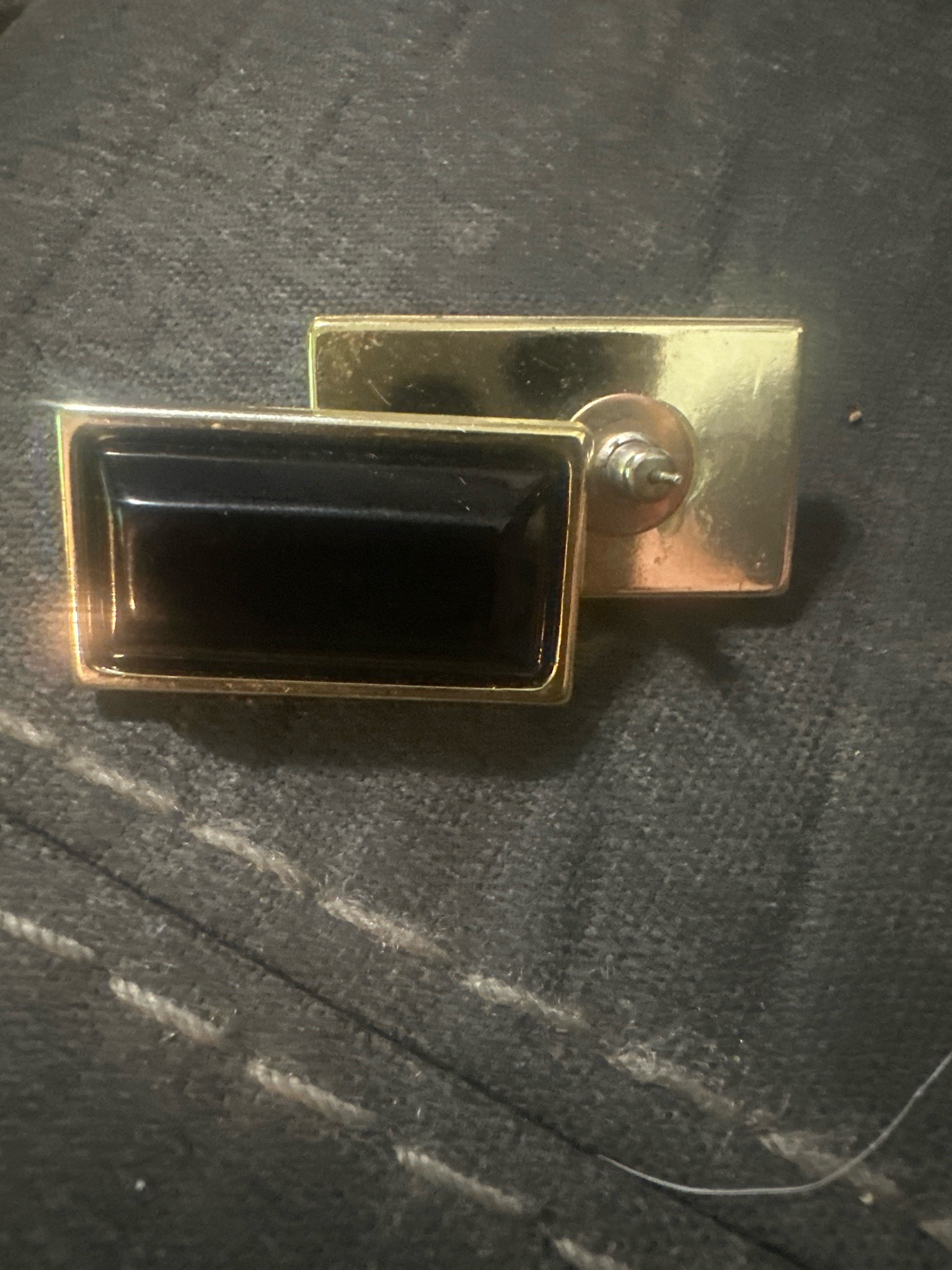 Submitted photo of Gold-tone rectangular cufflinks with black inlay