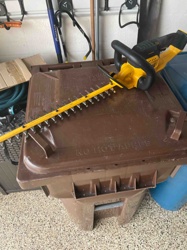 Cordless Electric Hedge Trimmer (Likely DeWalt)