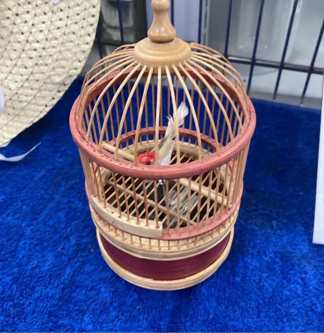 Submitted photo of Miniature wooden birdcage with mechanical bird