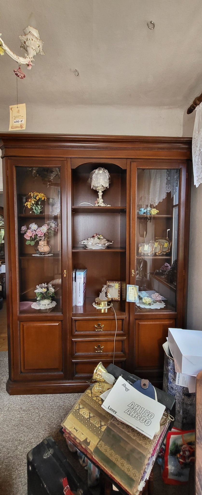 Submitted photo of Large wooden display cabinet with glass doors