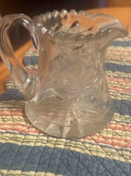 Cut Glass Creamer with Sawtooth Rim and Starburst Pattern