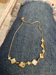Adjustable Gold Tone Bracelet with Clover and Star Charms