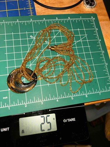 Multi-Strand Gold Beaded Necklace with Black and Gold Crescent Pendant