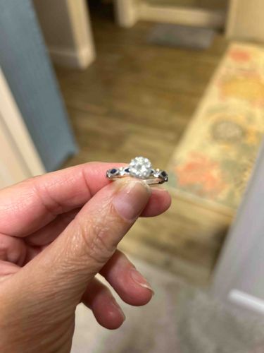 Round Brilliant Diamond Solitaire Ring with Sapphire Accents