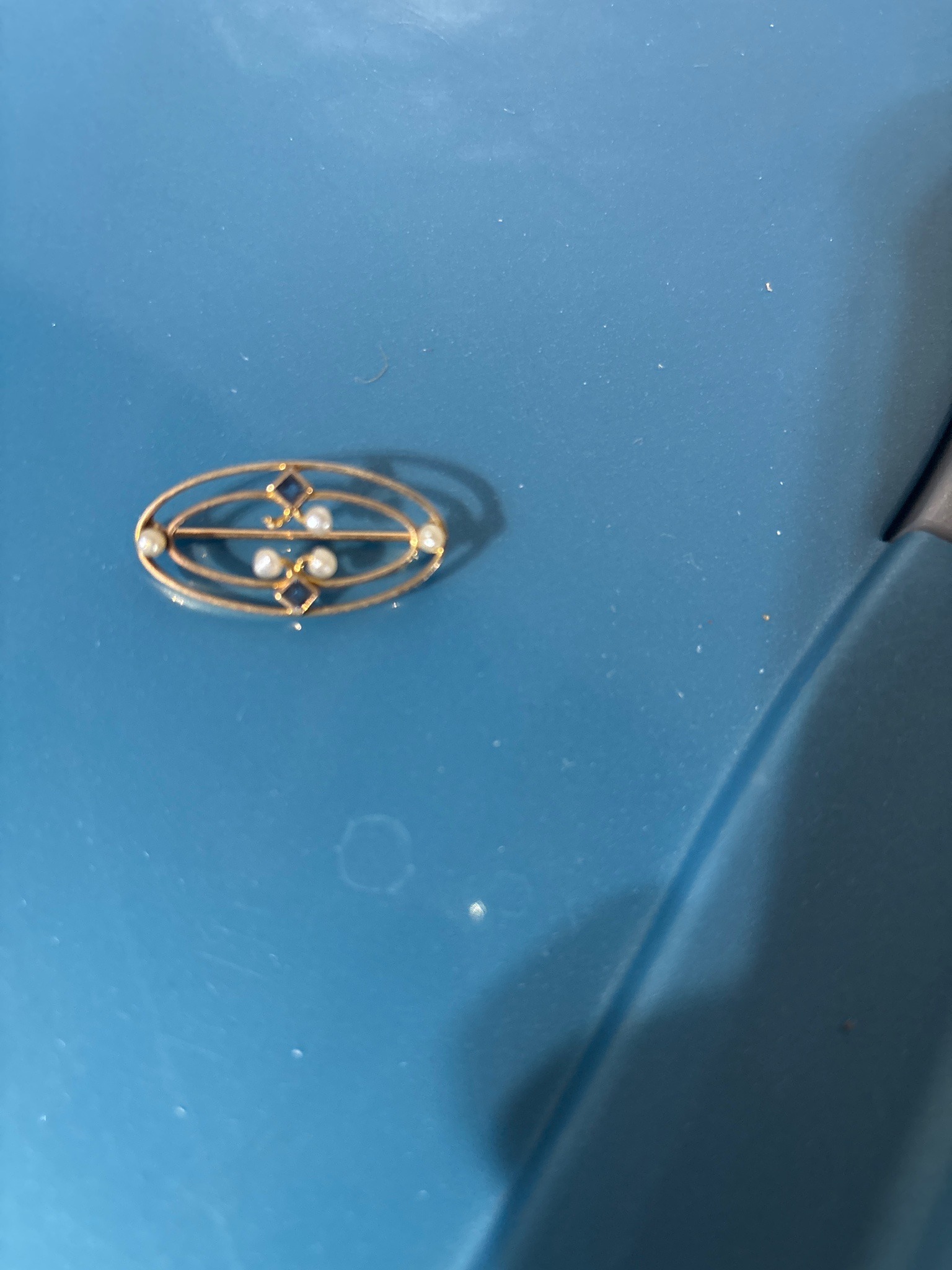 Submitted photo of Edwardian gold pearl and sapphire brooch