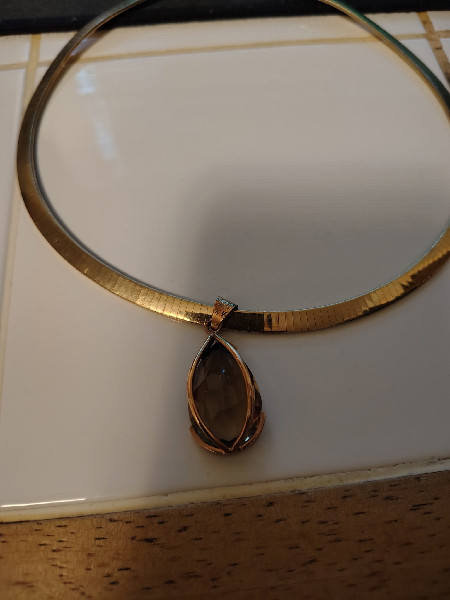 Submitted photo of Gold-tone omega chain necklace with pear-shaped gemstone pendant (unauthenticated)