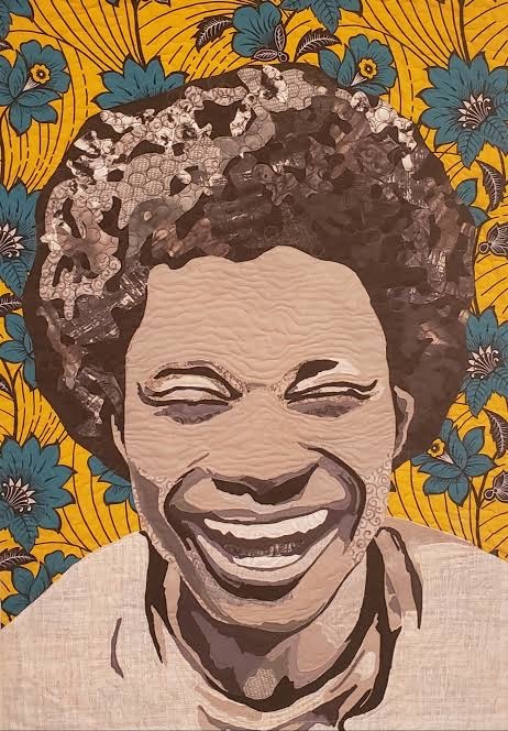 Submitted photo of Fiber art portrait quilt depicting a smiling person