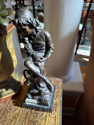 Bronze Figurine of a Seated Boy Reading