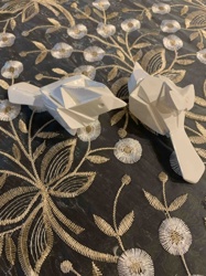 Pair of White Faceted Geometric Animal Sculptures