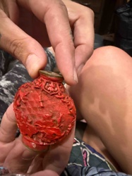 Carved Cinnabar Snuff Bottle