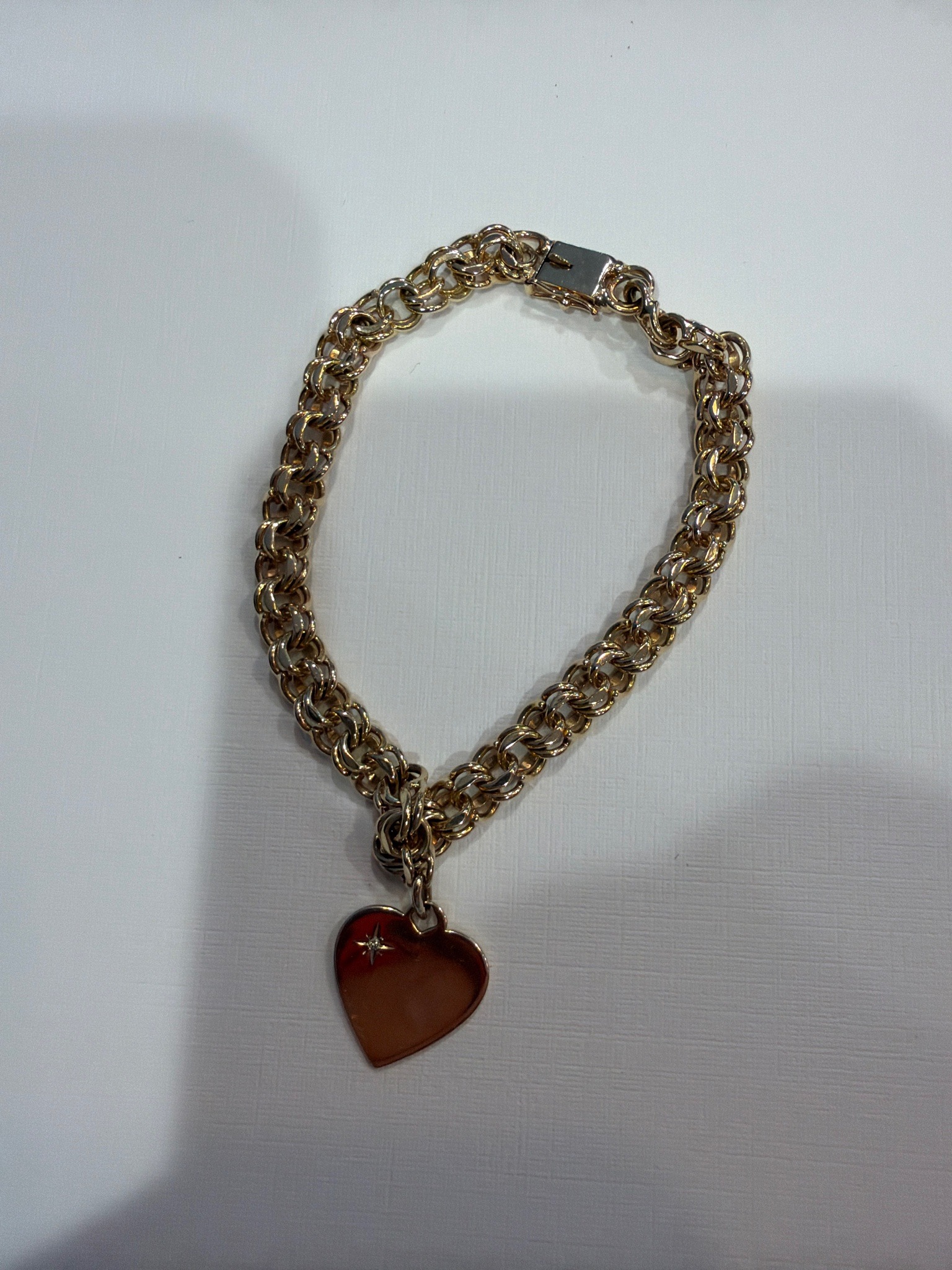 Submitted photo of Gold chain bracelet with heart charm (not authenticated)