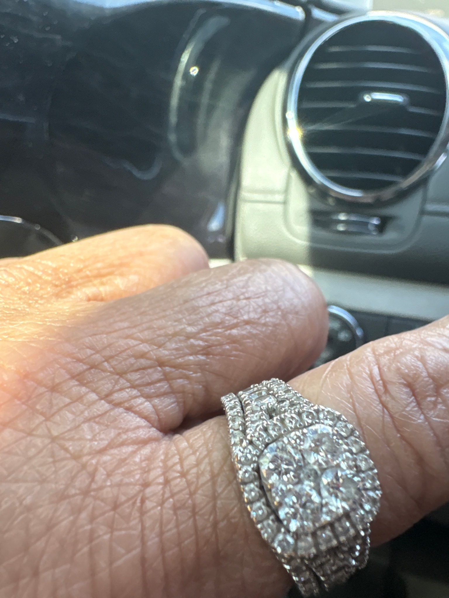 Submitted photo of Diamond and white metal double-halo engagement ring and wedding band set