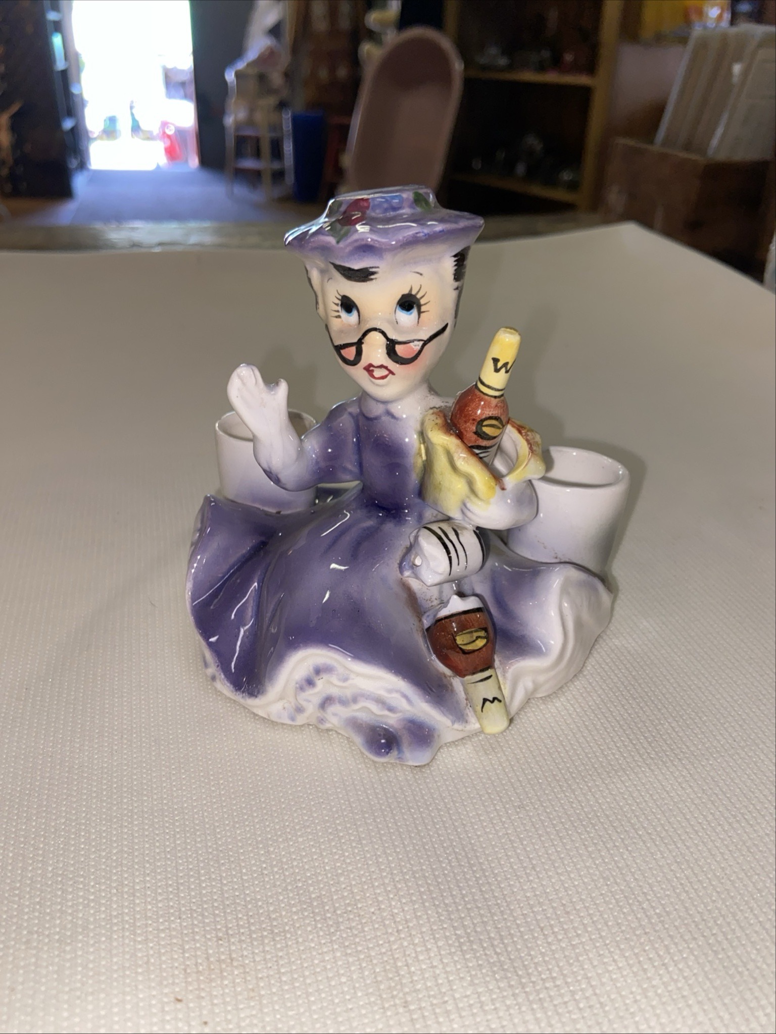 Submitted photo of Mid-century style ceramic grandmother barware caddy or planar figurine holder