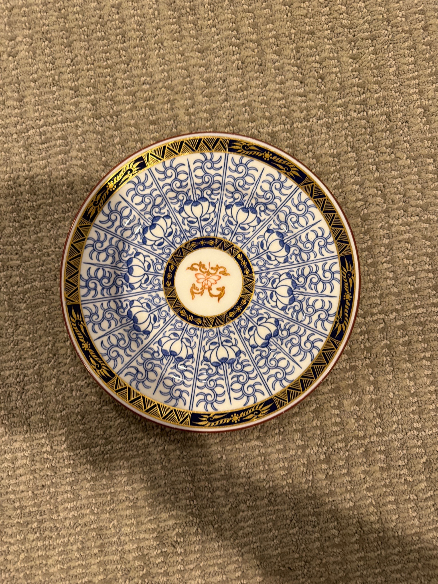 Submitted photo of Porcelain saucer, appears to be Royal Crown Derby (not authenticated)