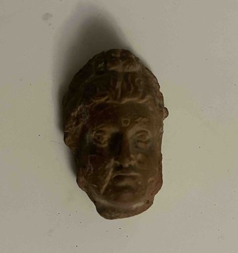 Fragmentary Head of a Deity (Likely Buddha or Bodhisattva)