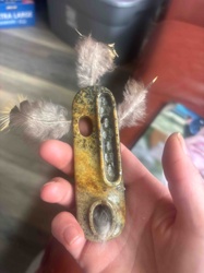 Carved Soapstone Object with Feathers and Stone Inlay