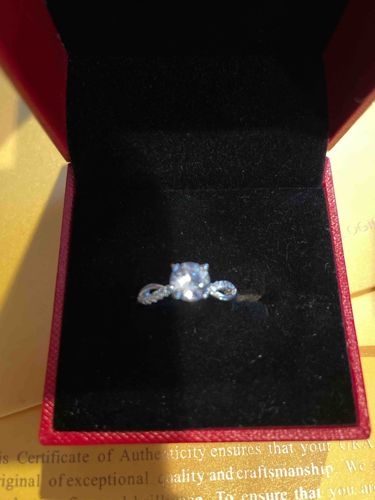 Solitaire Engagement Ring with Pave Set Twist Band