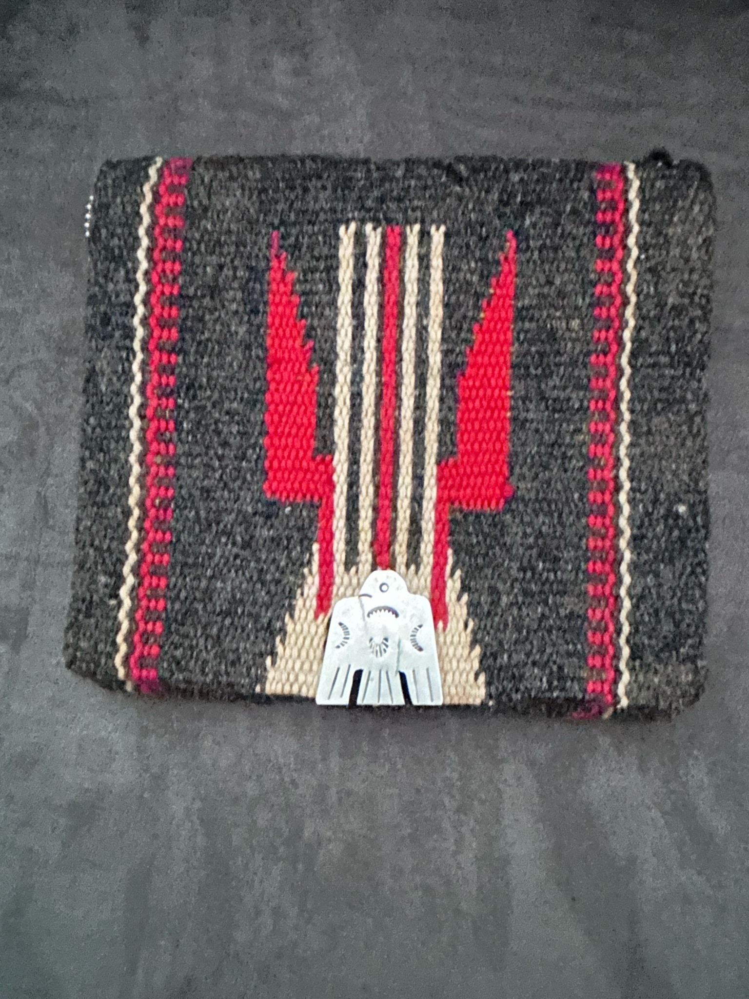 Submitted photo of Woven textile pouch with silver-tone metal thunderbird embellishment (unauthenticated)